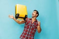 Trip man yellow studio travel happy background suitcase baggage journey flight traveler vacation Royalty Free Stock Photo