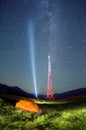 Trip in the mountains at night near the mobile signal tower tower in Ukraine in the Carpathians Ukraine. Metal red design against Royalty Free Stock Photo