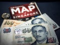 Trip to Singapore concept - Singapore dollar and map of Singapore