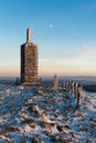 Monument on the top Snezka during moon in Czech Republic National Park Krkonose