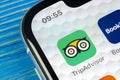 Tripadvisor application icon on Apple iPhone X screen close-up. Tripadvisor.com app icon. Social media network. Social media app