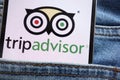 Tripadvisor logo displayed on smartphone hidden in jeans pocket