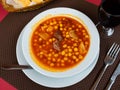 Tripe with chorizo and chickpeas served in bowl