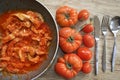 Tripe in pan with tomato sauce