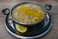 Tripe soup in a copper bowl  with lemon Royalty Free Stock Photo