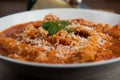 Tripe with tomato sauce called trippa alla romana, a typical dish from Lazio on wooden table