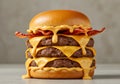 Triple cheeseburger with melted cheese Royalty Free Stock Photo