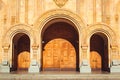 Triple church arched wooden door. Fretted arches. Exquisite carving. Holy Trinity Cathedral Tsminda Sameba in Tbilisi, Georgia. Re