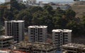 Triple construction building construction, under a blue sky Royalty Free Stock Photo