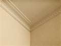 Triple crown molding in expensive home ceiling corner ornamental. Royalty Free Stock Photo