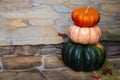 Triple decker heirloom pumpkins decorating the front porch for autumn