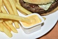 Triple meaty delicious hamburger with nice fries Royalty Free Stock Photo