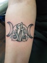 Tattoo of triple moon symbol