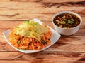 Triple Schezwan Fried Rice is a lip smacking complete meal combination of Rice, chicken,egg and crispy fried noodles served with Royalty Free Stock Photo
