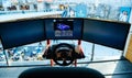 Triple screen setup with steering wheel and pedals racing games