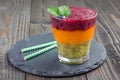 Triple smoothie in glass: kiwi-mint, mandarin-apricot and strawberry-blueberry, copy space Royalty Free Stock Photo