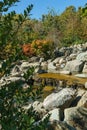 Triple waterfall splits into three streams in Japanese garden. Public landscape park of Krasnodar or Galitsky Park, Russia Royalty Free Stock Photo