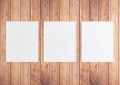 Triple 8x10 Vertical White Frame mockup on rustic wooden wall Royalty Free Stock Photo