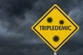 Tripledemic message for RSV, covid-19 and flu yellow warning road sign Royalty Free Stock Photo