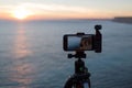 Tripod-mounted camera and ocean Royalty Free Stock Photo