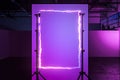 Tripods Holding Vertical Frame Made From Violet Neon Electric Light In Modern Stylish Photo Studio. 3D Rendering