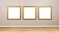 Triptych of Golden Square Empty Picture Frame at the Wall Royalty Free Stock Photo
