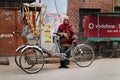 Trishaw driver on the street cold foggy morning in winter at Varanasi Royalty Free Stock Photo