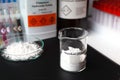 trisodium phosphate powder in glass, chemical in the laboratory