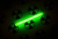 Tritium. Radioactive glow. Gaseous tritium light source in a glass vial. Radiation sign. Green glow hazards to employees Royalty Free Stock Photo