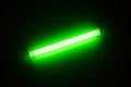 Tritium. Radioactive glow. Gaseous tritium light source in a glass vial. Radiation green glow hazards to employees