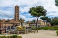 Tritons fountain and Basilica of Saint Mary in Cosmedin - Rome, Italy Royalty Free Stock Photo