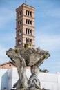 Tritons fountain and Basilica of Saint Mary in Cosmedin