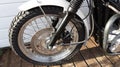 Triumph bonneville and pirelli mt 60 vintage front wheels detail on motorbike classic Royalty Free Stock Photo