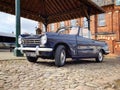 13/60 Triumph Herald parked in a country market town