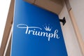 Triumph lingerie company logo brand and text sign on shop of girls underwear women