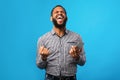 Excited black guy holding phone and gesturing Royalty Free Stock Photo