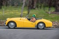 1959 Triumph TR3A Convertible driving on country road