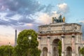 Triumphal Arch Arc de Triomphe du Carrousel at Tuileries gardens in Paris, France with the Eiffel Tower in the background at