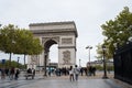Triumphal Arch monumental arch in France with people walking on the street