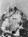 Triumphant woman at mountain summit Royalty Free Stock Photo