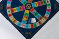 Trivial Pursuit game pieces which is a board game