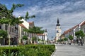 TRNAVA, SLOVAKIA Local and visitor stroll the Trojicne square, near the city tower, In Trnava, Slovakia Royalty Free Stock Photo