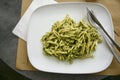 Troffie al pesto, pasta speciality of the Ligurian cuisine with sauce from garlic, pine nuts, basil and parmesan cheese, high Royalty Free Stock Photo