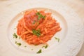 Trofie italian pasta with tuna fish sauce goumet food on white table