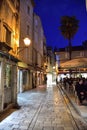 Restaurant in narrow streets of mediterranean city. Trogir at night. Croatia