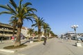 TROGIR, CROATIA, OCTOBER 01. 2017: Tourists visit the Marina with huge luxury yacht and awesome palm tree.