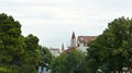 Trogir, Croatia - 07 25 2015 - View of the Bell Tower of the St. Lawrence Cathedral through the trees