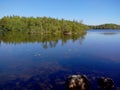 Troitsk pier near the Holy Trinity Anzersky skete of the Solovki monastery on the Anzersky island, the Solovki islands Royalty Free Stock Photo