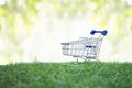 Trolley on green grass, Green Shopping concept