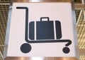 Trolley luggage sign post on white background shown in airport terminal